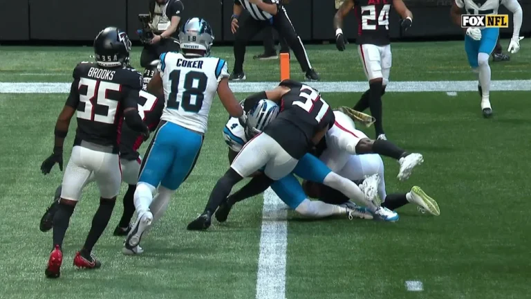 Tet fights for the endzone with a Panthers’ TD