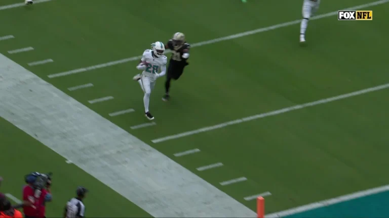 Washington and Achane push down the field on a Miami TD