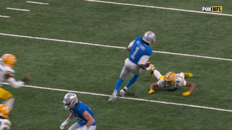 Jameson Williams spins out of a tackle and takes it the house