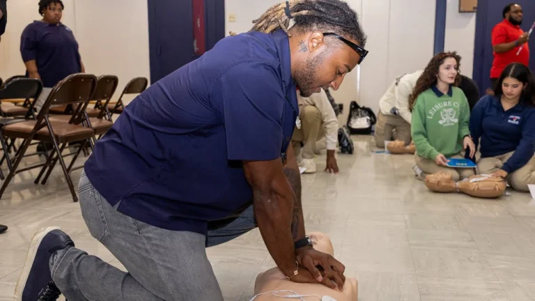 Justin Reid teaches CPR with American Heart Association New Orleans Saints