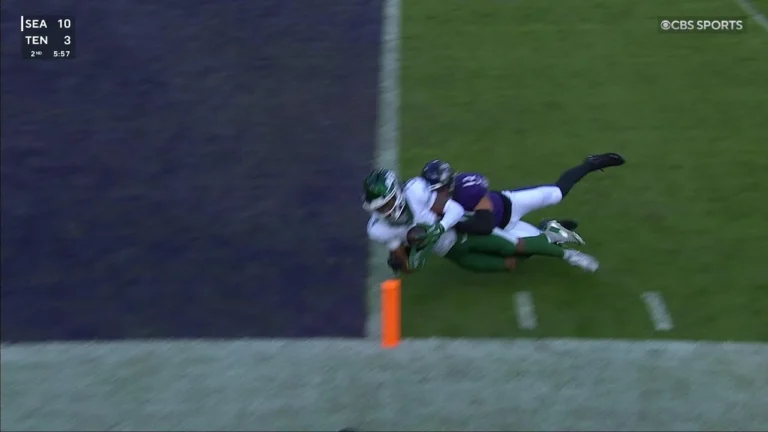 John Metchie dives for the touchdown