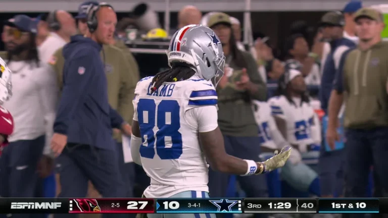 Dak buys time in the pocket for Lamb to get open