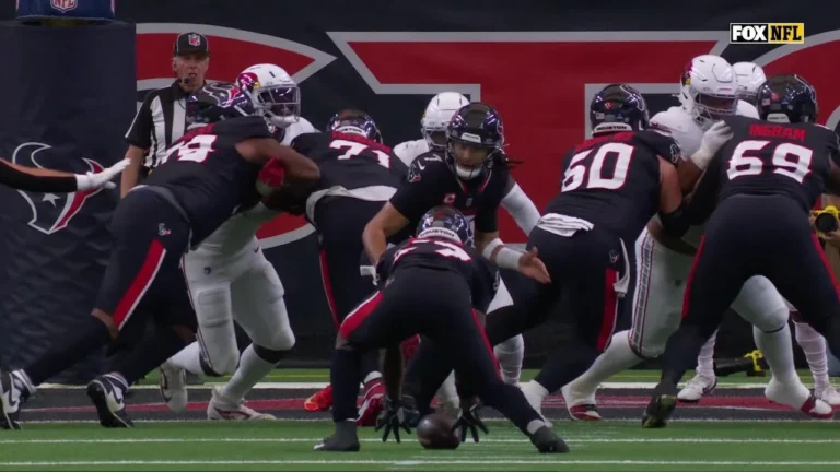 Woody Marks scoops the low snap and leaps into the endzone