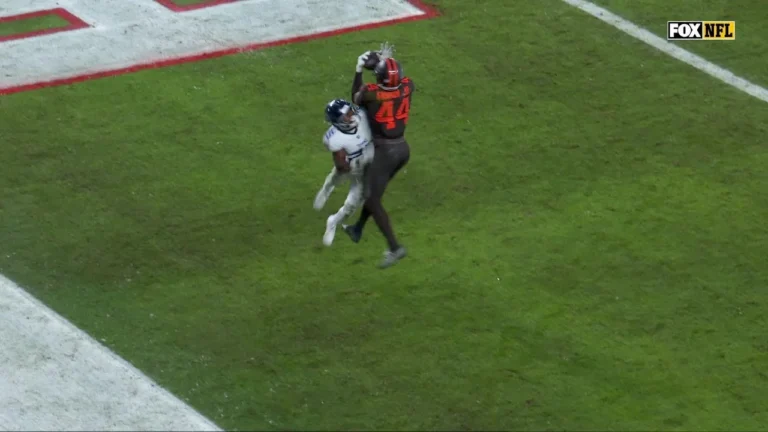 Harold Fannin mosses the defender for the touchdown